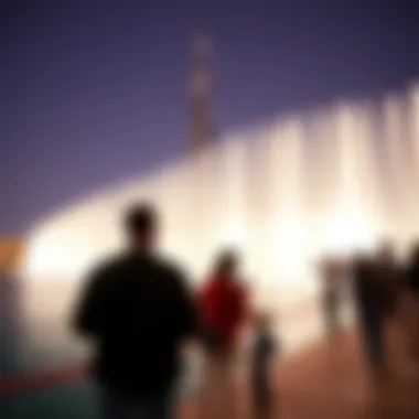 Visitors Experiencing the Fountain Show Visitors enjoying the fountain show with Burj Khalifa in the background