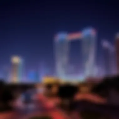 A vibrant cityscape at night showcasing the illuminated Silver Tower Cluster